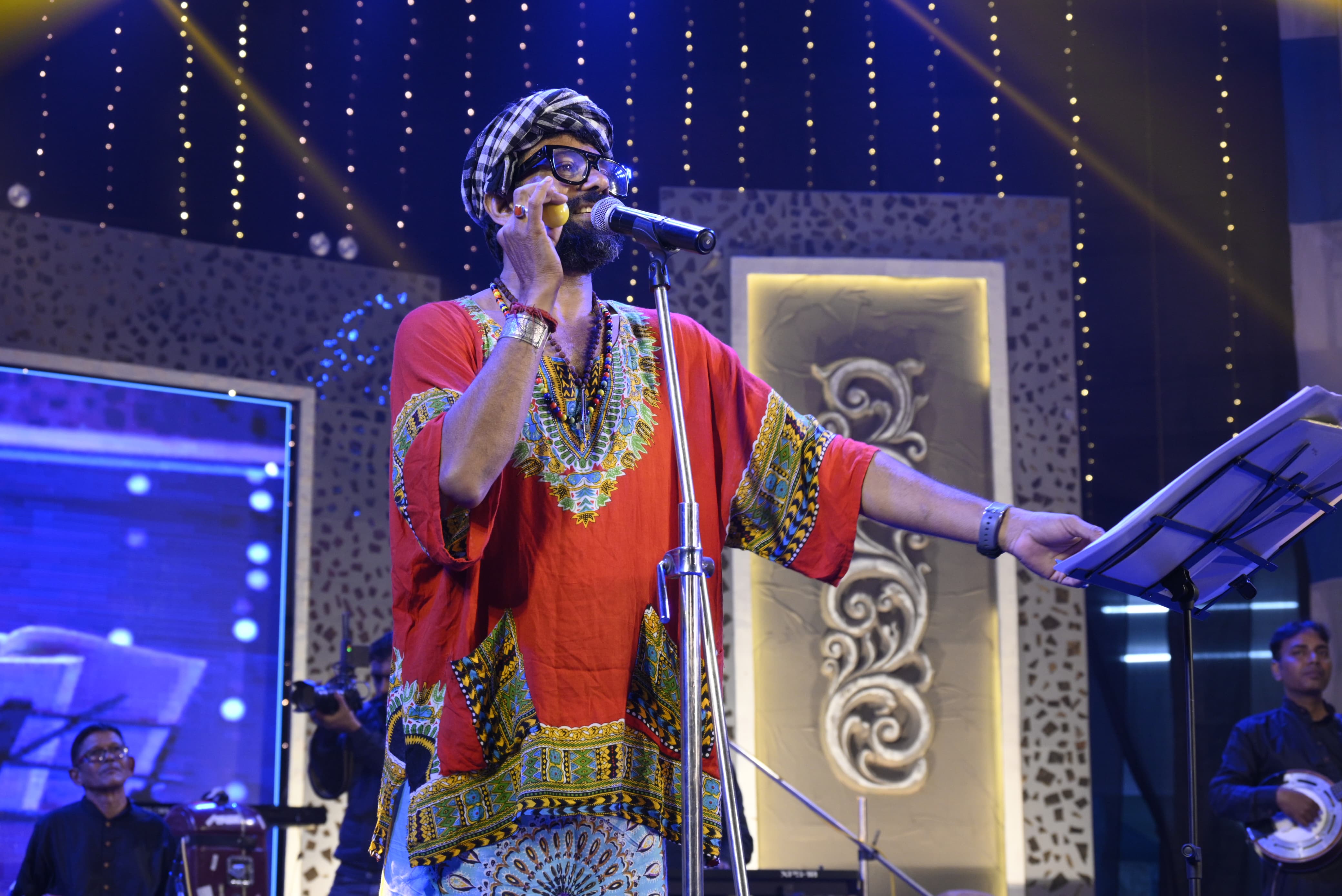 Mainak Paladhi — Founder and Lead Vocalist of MAINAKER DOLBOL performing live on stage